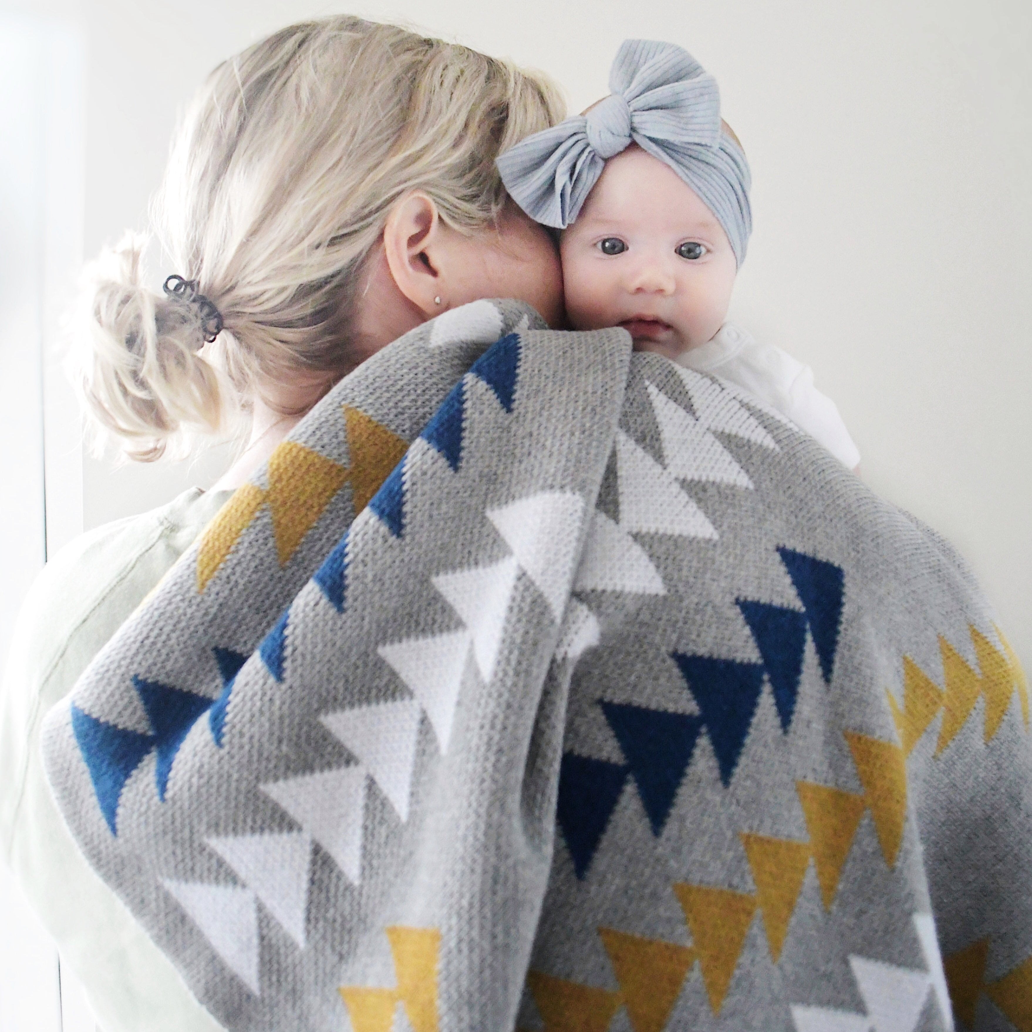 Made to Order Baby Boy Blanket in gray and navy with shops a woodland theme featuring arrows, little and brave, feathers and adventure awaits